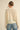 Back view of Liberty Knit Sweater in cream open-knit design