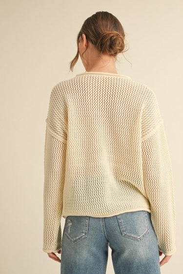 Back view of Liberty Knit Sweater in cream open-knit design