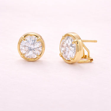 Livona Stud Earrings gold stud earrings with clear round zirconia stone in polished bezel setting minimalist everyday jewelry.