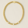 Gold chain necklace with zirconia accents on neutral beige background – Lyric Necklace by Matte