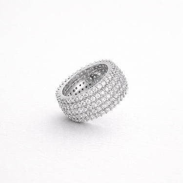 Malawi Ring silver wide pavé band ring fully encrusted with shimmering stones bold chunky statement ring on neutral background.