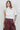 Maratea Blouse worn by model, front view, featuring asymmetric drape and relaxed elegant fit.