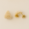 Gold triangular stud earrings with pearl detail on white linen backdrop, Margui Stud Earrings.