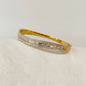 Gold stainless steel bangle bracelet with pavé crystal details on neutral background – Matte Jewelry
