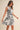 Marvin Dress zebra print mini dress movement shot showing swishy skirt