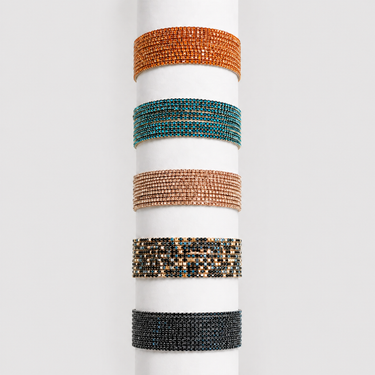 Mausi Bracelet multi-strand beaded wrap bracelet in assorted tones including bronze, amber, and turquoise accents, designed with a flexible stretch fit