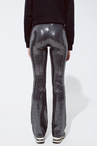 Sparkly black sequin flare pants with retro-inspired silhouette, flattering fit and bold party style by Matte