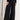 Model in Midnight Lace Pants showing high-rise satin waistband and wide-leg lace silhouette, paired with black heels.