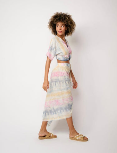 Model in Matte’s Mirage Crop Top — pastel tie-dye blouse with relaxed sleeves and twist detail at the front.