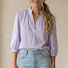Mirko Blouse soft lavender relaxed-fit blouse with split neckline front view on model.