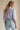 Mirko Blouse soft lavender blouse back view showing embroidered sleeve detail.