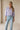 Mirko Blouse soft lavender blouse styled with light-wash jeans full-body front view.