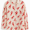 Beige shirt with red lobster pattern on a white background