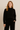 Model wearing black knit lounge sweater set with drawstring pants — Matte.
