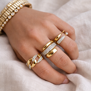 Morris Ring styled on hand with stacked gold rings, showcasing modern layered jewelry look.