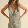 Nash Romper leopard print sleeveless romper front full body view on model showing deep V neckline and relaxed tailored fit