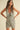 Nash Romper leopard print sleeveless romper front full body view on model showing deep V neckline and relaxed tailored fit