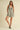 Nash Romper leopard print one-piece outfit front standing pose showcasing structured silhouette and flattering cut