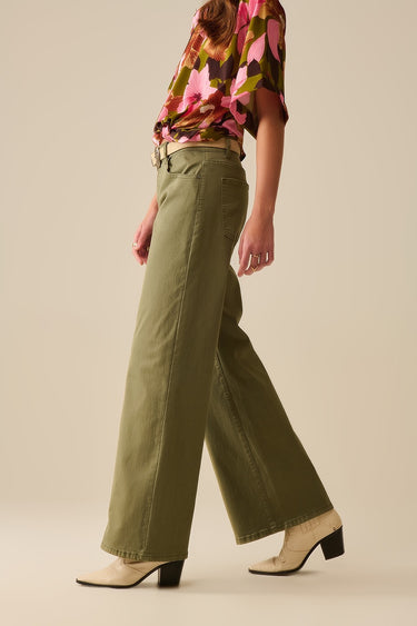 Nerina Pant – olive green wide-leg pants side view showing relaxed fit and drape.