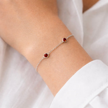 Neroni Bracelet fine silver chain bracelet with red stone detail close-up.