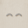 silver arc-shaped Nolan stud earrings with crystals on linen backdrop — minimalist sparkle studs by Matte