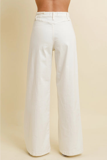 Nurcia Jeans back view showing high-rise waistband, relaxed wide-leg fit, and clean minimal back silhouette in off-white denim.