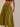 Olive cotton maxi skirt with balloon hem, elastic waist, and flowy silhouette — resort-style outfit.
