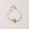 Plar Bracelet gold filled bracelet with shimmering stones and colorful multi-tone charm on neutral background, showing adjustable chain and delicate design