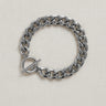 Plat Bracelet — flat-link silver chain bracelet with modern toggle clasp on linen background, polished and minimal design by Matte.