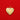 Pola Pendant gold heart charm with multicolor zirconia stones on a polished surface, photographed on a bold red background.