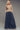 Porto Denim Pants full-length view showing skirt-like drape and elastic waistband in soft denim.