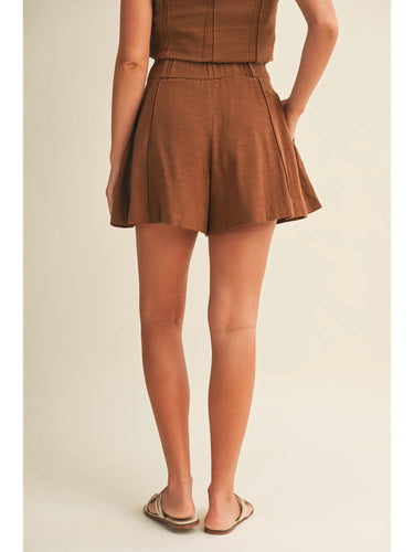 Ragit Short chocolate brown pleated shorts back view, showing clean tailored finish and relaxed leg shape.