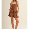 Ragit Short brown high-waisted pleated shorts full body front view, showing tailored silhouette, structured waistband, and lightweight summer fabric.