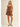 Ragit Short brown high-waisted pleated shorts full body front view, showing tailored silhouette, structured waistband, and lightweight summer fabric.