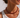 Ravn Necklace red beaded necklace worn on neck with white top, showing bold glossy beads and statement fit at neckline