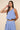 Ritzi Blouse front detail of vertical blue stripes, soft drape one shoulder crop top on model