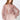 Model wearing Selene Metallic Blouse in rose metallic pleated fabric with button-down closure and long sleeves.