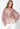 Model wearing Selene Metallic Blouse in rose metallic pleated fabric with button-down closure and long sleeves.