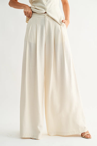 Rumi Pant ivory wide-leg trousers full body front view highlighting high-waisted fit, structured waistband, and airy lightweight fabric.
