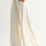 Rumi Pant cream wide-leg trousers side profile view showing flowing drape and relaxed elegant leg line.