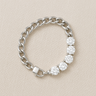 Silver chain bracelet with gold-filled zirconia accents on a neutral beige background – Sabine Bracelet by Matte