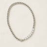 Silver chain necklace with alternating gold-filled zirconia links on a neutral linen background – Sabine Necklace by Matte