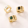 Sakura Ring gold signet style ring with faceted center stone available in green, black, or clear stones bold statement ring on neutral background