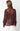 Woman wearing a sheer burgundy blouse with a white background