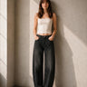 Shimi Jean by Matte in black denim with allover rhinestone detailing, relaxed wide-leg fit and high-rise waist, front view on model.