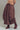 Front view of brown parachute maxi skirt showing cargo-inspired details and volume.
