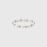 A gold-filled stretch ring with polished silver beads and pearls displayed on silver backdrop