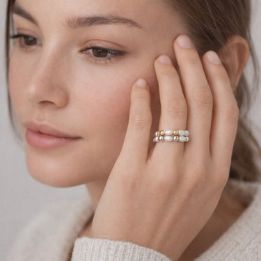 Pearl Beaded Stacking Rings with Gold and Silver Accents on Model Hand – Delicate Freshwater Pearl Stretch Rings Jewelry Close-Up by Matte Jewelry