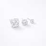 Sient Stud Earrings silver version close-up showing small and medium size crystal studs with polished silver settings and brilliant zirconia stones