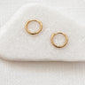 Silva Huggie Earrings — beaded gold plated huggies on white linen background, delicate, lightweight, and timeless jewelry by Matte.